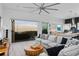 Spacious living room featuring ocean views, modern furnishings, and hardwood floors at 6480 S Atlantic Ave, New Smyrna Beach, FL 32169