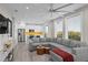 Modern living room and kitchen featuring stainless steel appliances at 6480 S Atlantic Ave, New Smyrna Beach, FL 32169