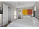 View of spacious bedroom with en suite bathroom, modern furnishings and closet access at 6480 S Atlantic Ave, New Smyrna Beach, FL 32169