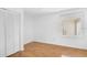 Bright bedroom with hardwood floors, closet and view to the outside at 6735 Edgeworth Dr, Orlando, FL 32819