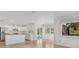Open living space adjacent to an eat-in kitchen overlooking the backyard pool at 6735 Edgeworth Dr, Orlando, FL 32819