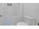 White tiled shower room with glass partition and blue tiled floors at 6735 Edgeworth Dr, Orlando, FL 32819