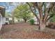 Lush backyard with mature trees, lawn, and plenty of space at 7121 Stockholm Way, Orlando, FL 32822