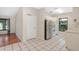 The kitchen features neutral cabinets, white appliances and tile floors at 7121 Stockholm Way, Orlando, FL 32822