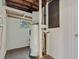 Water heater and utilities in small room with concrete floor at 7121 Stockholm Way, Orlando, FL 32822