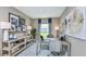 Comfortable home office with a desk, chair, shelves, décor, and ample natural light at 7359 Capstone Dr, Groveland, FL 34736