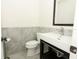 Modern bathroom featuring a sleek vanity with stone countertops, updated fixtures, and a contemporary design at 7536 Fenwick Cove Ln, Orlando, FL 32819