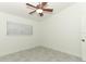 Cozy bedroom featuring neutral walls, a window, ceiling fan, and a closet at 7536 Fenwick Cove Ln, Orlando, FL 32819