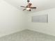 Bedroom with light-colored walls, window with blinds and ceiling fan at 7536 Fenwick Cove Ln, Orlando, FL 32819