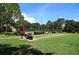 Enjoy outdoor recreation with this community bocce court surrounded by lush landscaping at 7536 Fenwick Cove Ln, Orlando, FL 32819