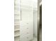 Closet with custom shelving and drawers at 7536 Fenwick Cove Ln, Orlando, FL 32819