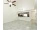 Living room featuring tall ceiling, tile floors, and a breakfast bar connecting to the kitchen at 7536 Fenwick Cove Ln, Orlando, FL 32819