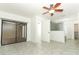 Main bedroom with tile floors, ceiling fan, and en suite bathroom at 7536 Fenwick Cove Ln, Orlando, FL 32819