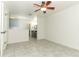 Main bedroom features tile floors, ceiling fan, and bathroom with vanity sink at 7536 Fenwick Cove Ln, Orlando, FL 32819