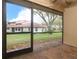 Screened-in back porch/patio with a view of a large tree at 7536 Fenwick Cove Ln, Orlando, FL 32819
