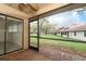 Screened-in back porch/patio with a view of the lawn at 7536 Fenwick Cove Ln, Orlando, FL 32819