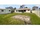 Large fenced backyard with a shed and a covered patio at 759 Dromedary Dr, Kissimmee, FL 34759