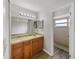 Bathroom with a large vanity and an updated tiled shower at 759 Dromedary Dr, Kissimmee, FL 34759