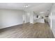 Spacious living room with vaulted ceiling and wood flooring; great layout for entertaining at 759 Dromedary Dr, Kissimmee, FL 34759
