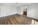 Bright main bedroom with wood flooring and an attached bathroom at 759 Dromedary Dr, Kissimmee, FL 34759