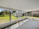 The patio features a roof and screen walls with views of the backyard at 759 Dromedary Dr, Kissimmee, FL 34759