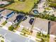 Aerial view of property highlighting its well-defined boundaries, lush landscaping, and solar panels at 7916 Wandering Way, Orlando, FL 32836
