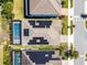 Aerial view of home featuring roof-mounted solar panels and a refreshing screened-in pool at 7916 Wandering Way, Orlando, FL 32836