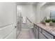 Well-lit bathroom featuring granite counters and a glass-enclosed shower at 7916 Wandering Way, Orlando, FL 32836
