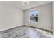 Bright, empty bedroom with ample natural light and wood grain flooring at 7916 Wandering Way, Orlando, FL 32836