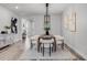 Contemporary dining room boasting modern decor, stylish furnishing and wood-look flooring at 7916 Wandering Way, Orlando, FL 32836