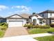 Attractive single-story home with a well-maintained lawn and a brick driveway at 7916 Wandering Way, Orlando, FL 32836