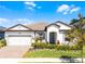 Beautiful single-story home with a landscaped front yard and a welcoming entrance at 7916 Wandering Way, Orlando, FL 32836