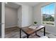 Cozy home office featuring a modern wood desk, natural lighting and wood-look flooring at 7916 Wandering Way, Orlando, FL 32836