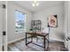Comfortable home office with stylish wood flooring, plenty of natural light, and modern decor at 7916 Wandering Way, Orlando, FL 32836