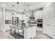 Modern kitchen with stainless steel appliances, granite countertops, and a center island with seating at 7916 Wandering Way, Orlando, FL 32836