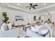 Spacious living room with hardwood floors, comfortable seating, and a stylish entertainment center at 7916 Wandering Way, Orlando, FL 32836