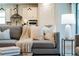 Living room with a comfortable sofa, decorative pillows, and a stylish side table with lamp at 7916 Wandering Way, Orlando, FL 32836