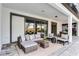 Inviting covered patio with comfortable seating and stylish outdoor decor at 7916 Wandering Way, Orlando, FL 32836