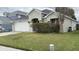 Charming single-Gathering home features a two-car garage, well-maintained landscaping, and a welcoming front entrance at 8419 Fort Thomas Way, Orlando, FL 32822