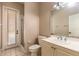 Bright bathroom with tiled flooring, shower, and single vanity at 8661 Crestgate Cir, Orlando, FL 32819
