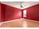 Spacious bedroom with a window and wood laminate flooring at 8661 Crestgate Cir, Orlando, FL 32819