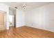 Bedroom with wood floors and a door leading to the bathroom at 8661 Crestgate Cir, Orlando, FL 32819
