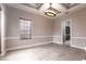 Dining room with custom trim, hardwood floors and a view into the kitchen at 8661 Crestgate Cir, Orlando, FL 32819