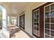 Exterior detail showing the brick paved porch and the home's attractive columns and exterior doors at 8661 Crestgate Cir, Orlando, FL 32819