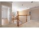Carpeted hallway with chandelier and view into another room at 8661 Crestgate Cir, Orlando, FL 32819