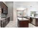 Spacious kitchen featuring granite countertops, stainless steel appliances and an island at 8661 Crestgate Cir, Orlando, FL 32819