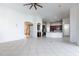 Open living room with tile floors that opens up to a kitchen and dining area at 8661 Crestgate Cir, Orlando, FL 32819