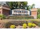 Palm Lake entrance sign framed by lush landscaping at 8661 Crestgate Cir, Orlando, FL 32819