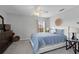 Cozy bedroom features a ceiling fan, window, and carpeted floors at 9228 Cardinal Meadow Trl, Orlando, FL 32827