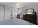 Comfortable bedroom boasts natural light from the window and includes a chair at 9228 Cardinal Meadow Trl, Orlando, FL 32827